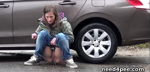  Teen girlfriends pissing behind a parked car